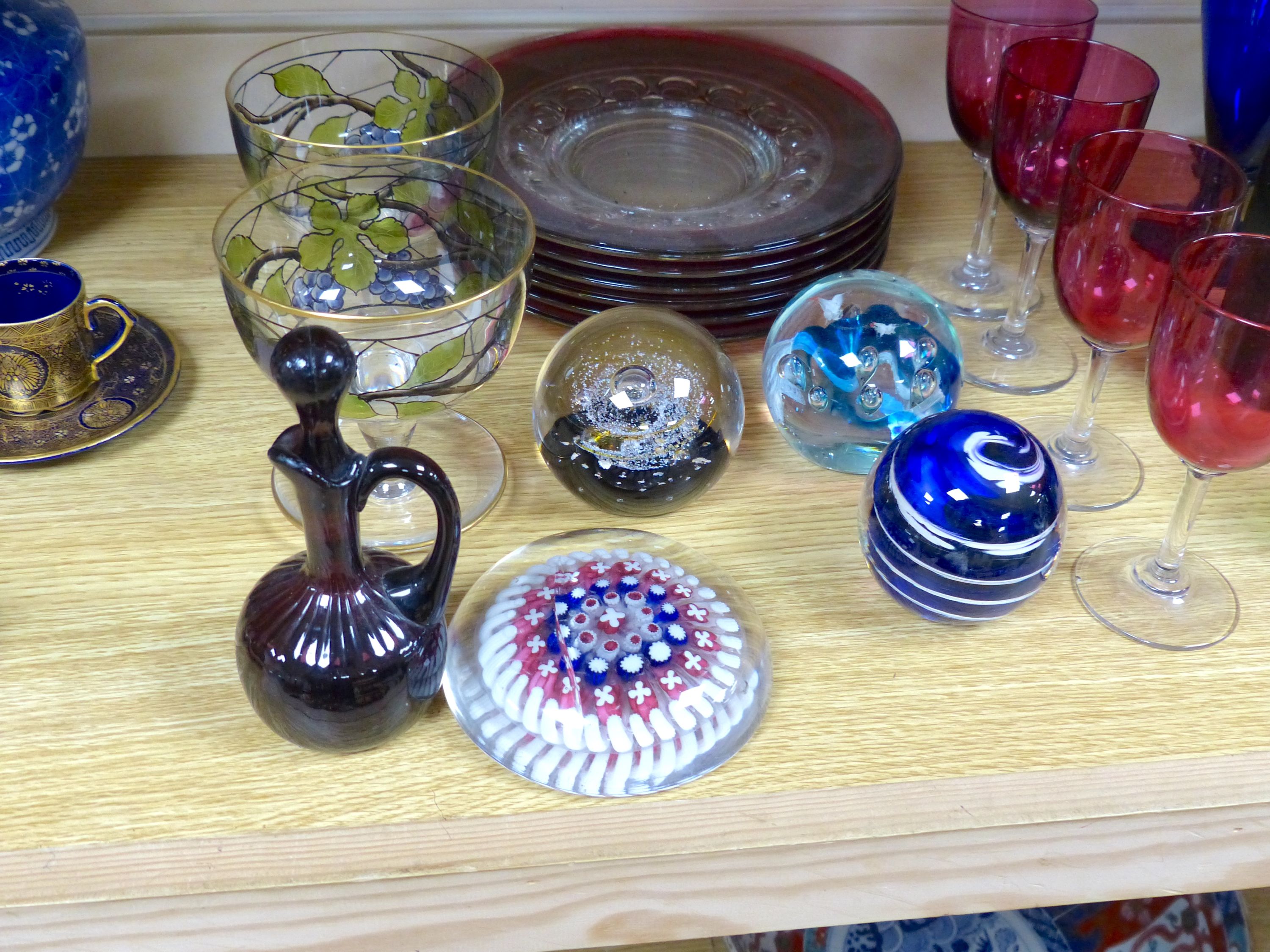 A quantity of mixed coloured glass and paper weights